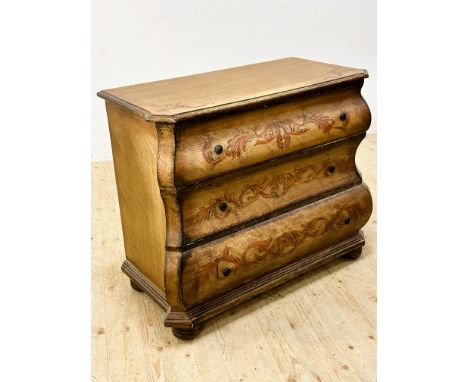 A distressed painted finish reproduction bombe commode in the Dutch style fitted three long drawers, with painted sway decora