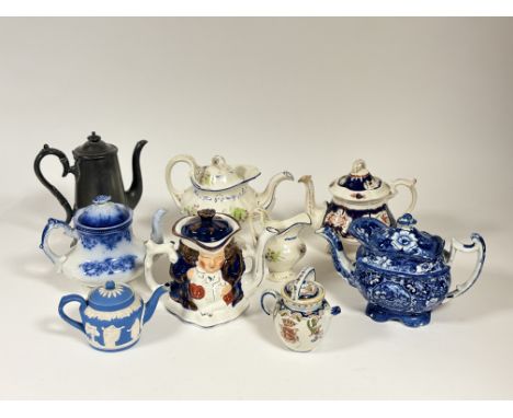 A collection of eight teapots and a milk jug comprising, an Adam's Jasperware teapot with traditional scene (h-12cm), a Aller