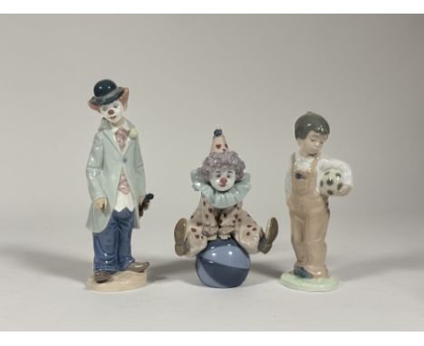 A group of two Lladro figures - Circus Sam Clown (5472), Having a Ball (5813) and Nao Porcelain figurine - Wanna Play?.(loss 