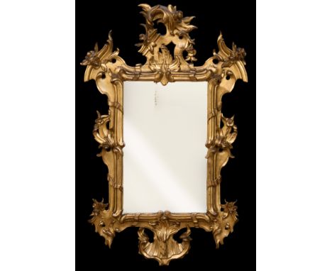 Mirror; Spain Carlos III period, second third century XVIII.Gilded and carved wood.It has slight faults and cracks.Measuremen