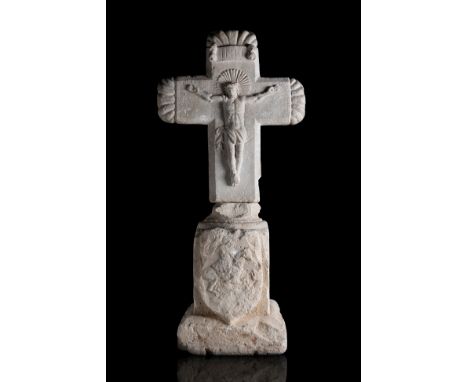 Cross and pedestal; 16th and 18th centuries.Stone carving.Pedestal adapted to the carving of the cross.Measurements: 94 x 45 