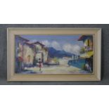 A framed oil on canvas of a Mediterranean village, signed Campria. H.53 W.92cm