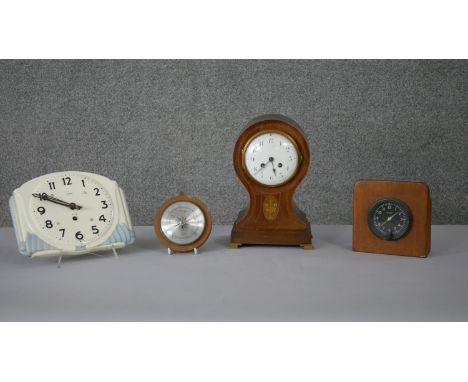 A collection of clocks and barometers. Including an Art Deco ceramic clock, a mahogany inlaid mantle clock and a barometer. H