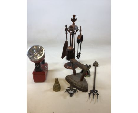 A vintage Space Beam torch together with a fire side companion, a flat iron and other items