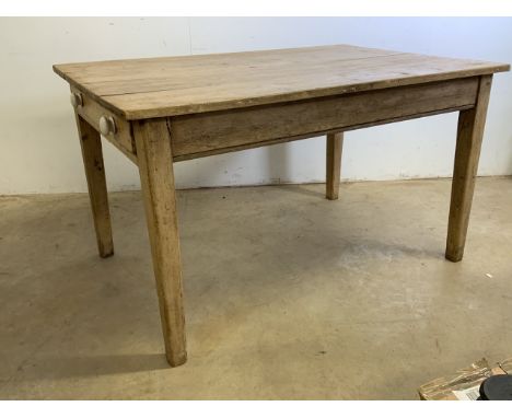 An Victorian pine country kitchen table on tapered legs, drawers either side with ceramic handles. W:132cm x D:89cm x H:76cm