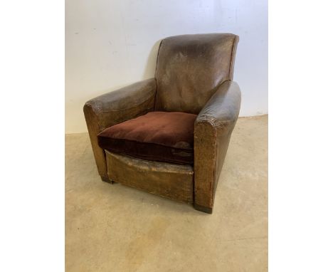 An Art Deco brown leather club chair with upholstered cushion. W:88cm x D:90cm x H:80cm