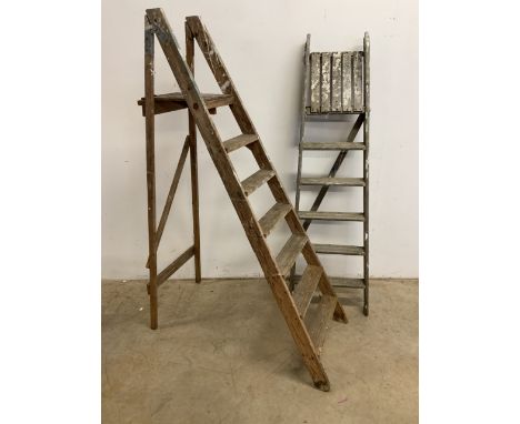 Two pairs of vintage step ladders. 
