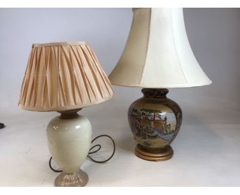 Two ceramic based lamps. One with Japanese images, the other crackle glaze H:65cm tallest lamp to top of shades 