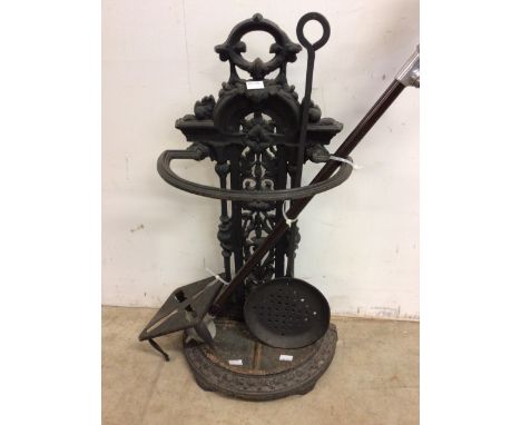 A cast iron companion set with utensils and a shooting stick and a bed warmer. 