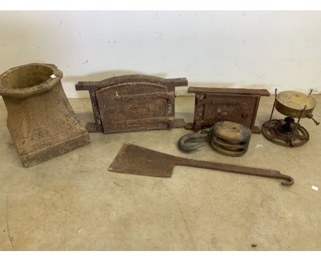 Two heavy metal doors a large pulley with war department broad arrow a large metal cleaver with hook etc. 