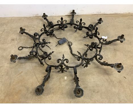 A wrought iron gothic style chandelier.  W:110cm x D:110cm x 