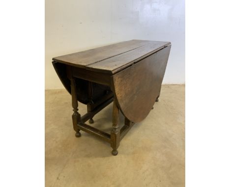 An 18th century oak gate leg Napoleon table. W:121cm x D:48cm x H:69cmW:121cm x D:160cm x H:69cm