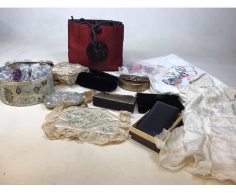 A Victorian christening gown and bonnet, vintage embroidered cushion and other items, tin of buttons, bags, and a boxed Bally