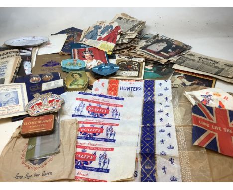 A quantity of coronation and royal memorabilia together with vintage tins. Includes coronation bread wrappers, drinks mats, n