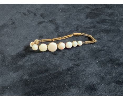 An opal graduated bracelet.