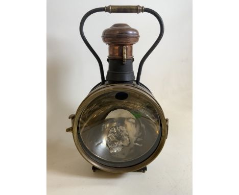 A vintage brass and copper steam locomotive railway lamp.H:57cm