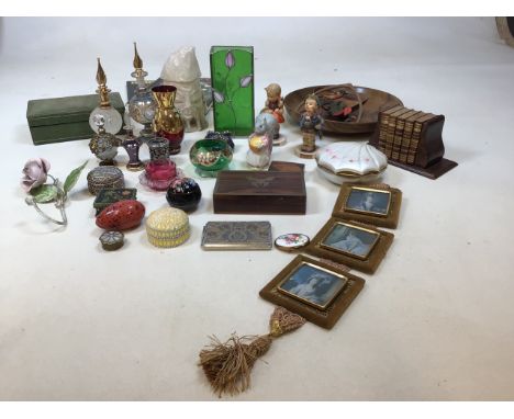 A quantity of decorative trinket boxes, perfume bottle, German figures, Goody Tiptoes Beatrix Potter figure, miniature books 
