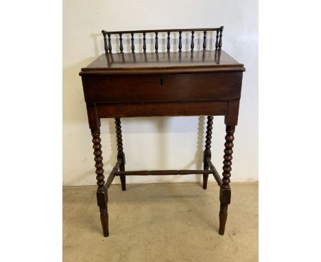 A late Victorian clerks desk with bobbin turned legs and stretcher bars to base. Lift up lid and gallery to top. W:73cm x D:5