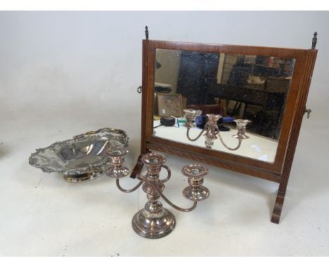 A swing mirror also with a silver plated table candelabra and a large platted handled dish. 