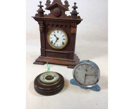 An Ansonia Company clock in A/F condition  W:27cm x H:38cm also with a barometer and a Smith Alarm clock 