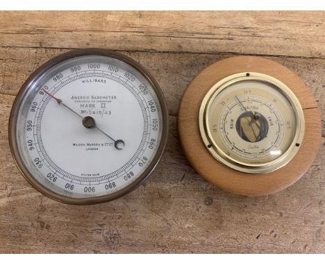  A Wilson, Warden and co ltd London brass barometer also with another barometer.