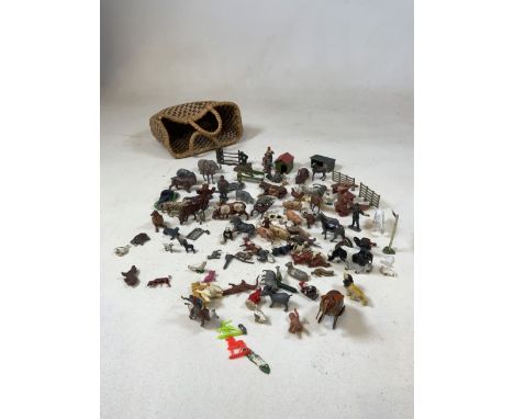 A quantity of metal farm, zoo and miscellaneous animals and figures including a dog in a kennel - some Britains. In a vintage