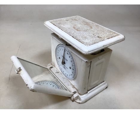 A 1920s pair of painted cast iron bathroom scales with drop down mirror W:25cm x D:16cm x H:21cm