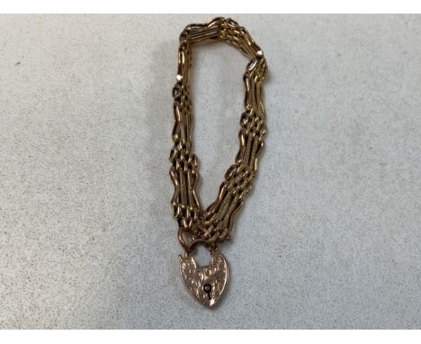 A 9 carat gold gate link bracelet. Weight 12gm