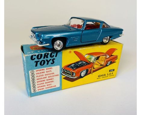 A Corgi Toys No. 241 Ghia L.6.4 saloon Die Cast Car (dark metallic blue body with red interior and spun hubs, dog figurine to