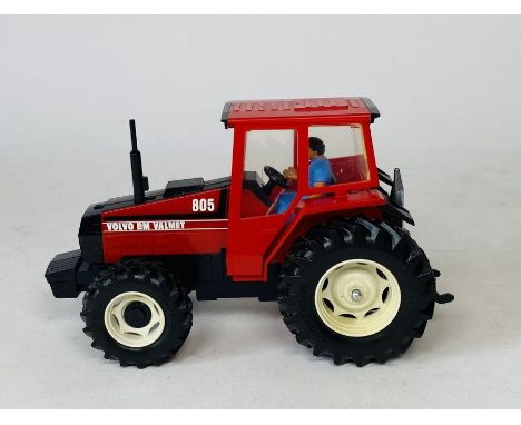 A Britains PROTOTYPE SAMPLE Volvo BM Valmet 805 Model Tractor - Features sample sticker to rear of model. This prototype has 