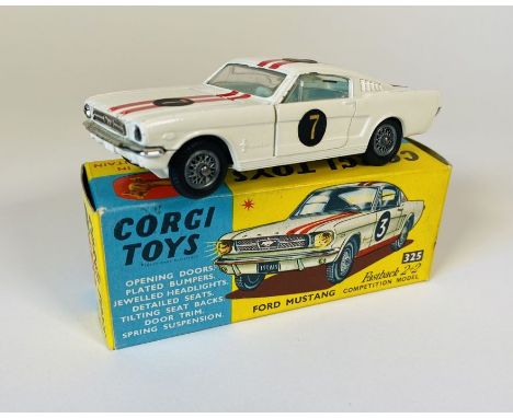 A Corgi Toys No: 325 Ford Mustang Fastback 2+2 competition model (white body with red twin racing stripe, No.7 round decals, 