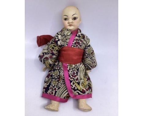 Schoennau &amp; Hoffmeister Antique German 4900 Oriental Cabinet sized small doll 22cm. The head has fixed brown eyes in brow