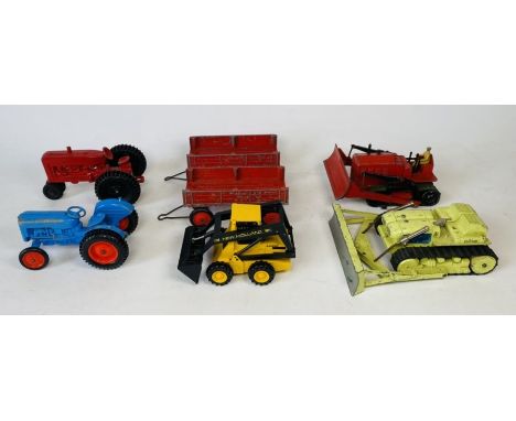 A collection of unboxed bulldozers and tractors, to include, Dinky, Corgi and Crescent tractor and trailer - All unboxed (7)
