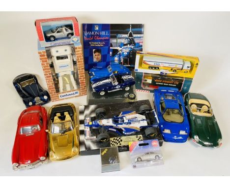 An assortment of Die Cast Models, including a confused.com robot. Some of the die cast models, are damaged, or have parts mis