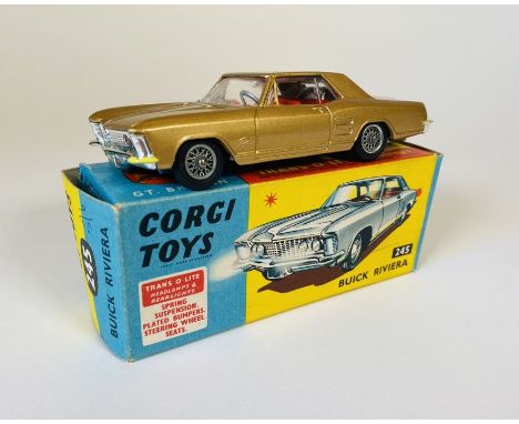 A Corgi Toys No: 245 Buick Riviera Die Cast Car (gold body with red interior and wire wheels).&nbsp; With picture box, blue &