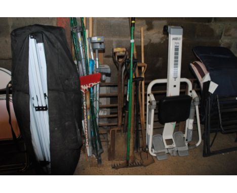 A bundle of long handled gardening tools