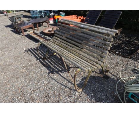 A wooden and wrought iron bench AF