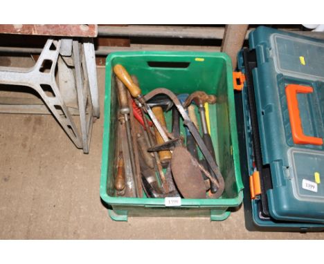 A box containing various hand tools and a show last