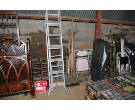 A bundle of long handled gardening tools 