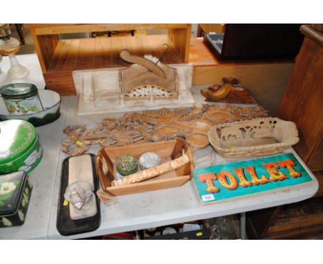 A collection of various carved wooden items to include all shelf, crumb tray and brush, door stop etc.
