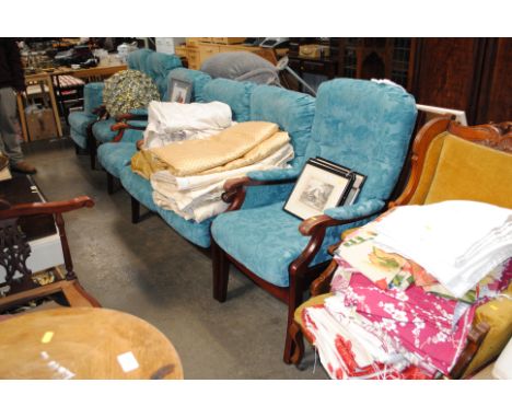 A button back upholstered two seater settee, matching footstool and four armchairs