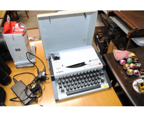 An Olympia Travel Deluxe portable typewriter