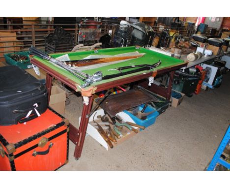 A snooker table measuring approx. 39 x 75 and a quantity of various cues