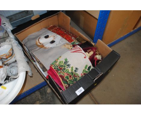A box containing curtains, table cloths etc.