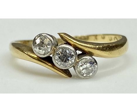 VINTAGE 18CT GOLD THREE-STONE DIAMOND RING the round cut stones individually set to closed mounts, estimated total diamond we