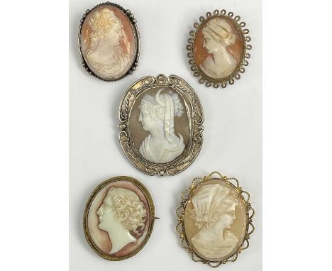 FIVE VINTAGE SHELL CARVED &amp; OTHER CAMEO BROOCHES the largest showing a Greek type goddess holding a sickle in an unmarked