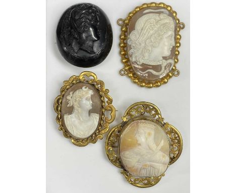 VICTORIAN PINCHBECK &amp; ONE OTHER SHELL CARVED CAMEO BROOCHES, and a carved jet cameo brooch, the largest Pinchbeck example