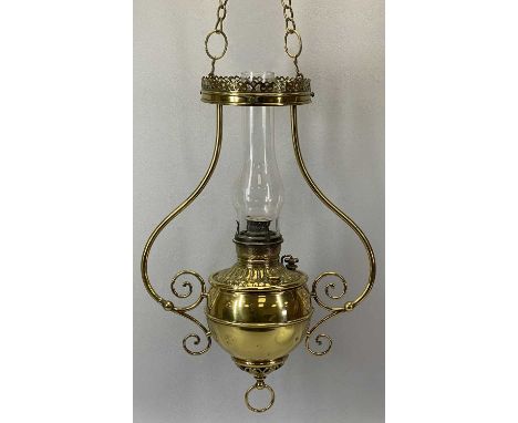 AMERICAN HANGING BRASS OIL LAMP, late 19th Century, the reservoir with embossed decoration, tubular frame with ornate chains,