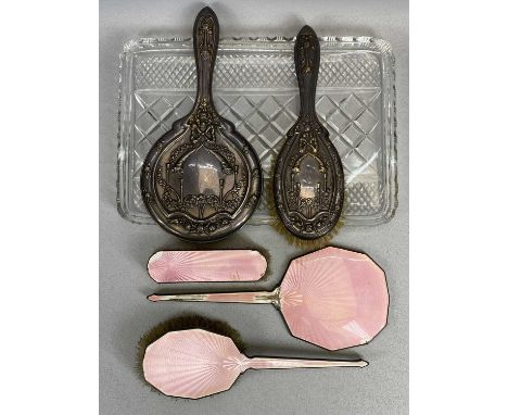 HALLMARKED SILVER DRESSING TABLE ITEMS ON A RECTANGULAR CUT GLASS TRAY, to include a circular hand mirror and single matching