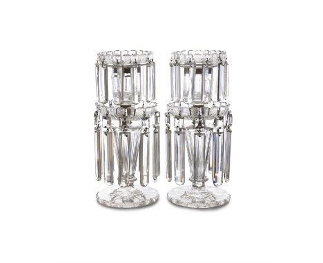 A PAIR OF EARLY 19TH CENTURY TWO-TIERED LUSTRE HUNG CANDLESTICKS, the graduated saucer shaped sconces with brass fittings, on